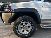 Расширители колесных арок Mitsubishi Pajero Sport (вылет 70 мм) с накладками на бампер MPS ST