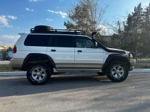 Расширители колесных арок Mitsubishi Pajero Sport (вылет 70 мм) с накладками на бампер MPS ST