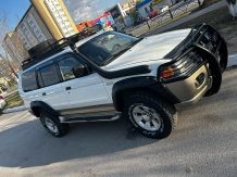 Расширители колесных арок Mitsubishi Pajero Sport (вылет 70 мм) с накладками на бампер MPS ST